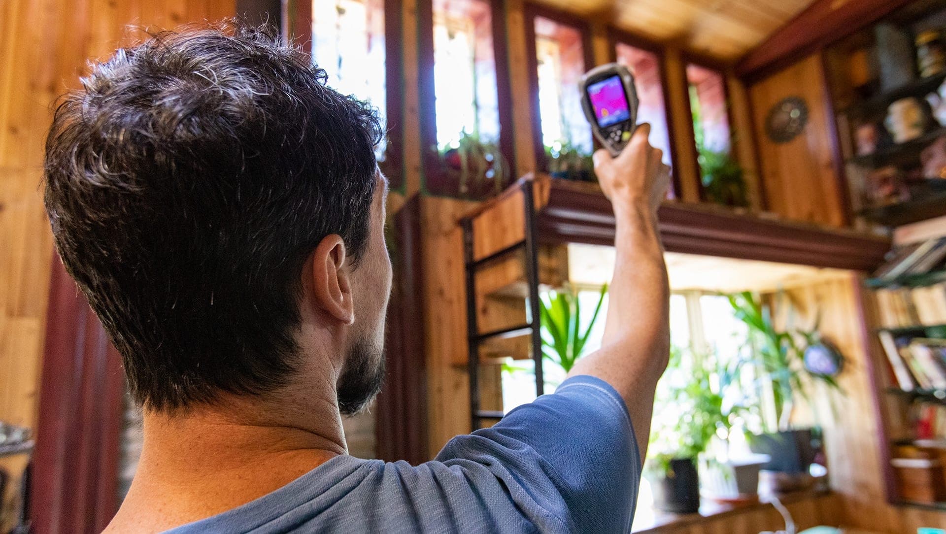 Person using thermal camera indoors